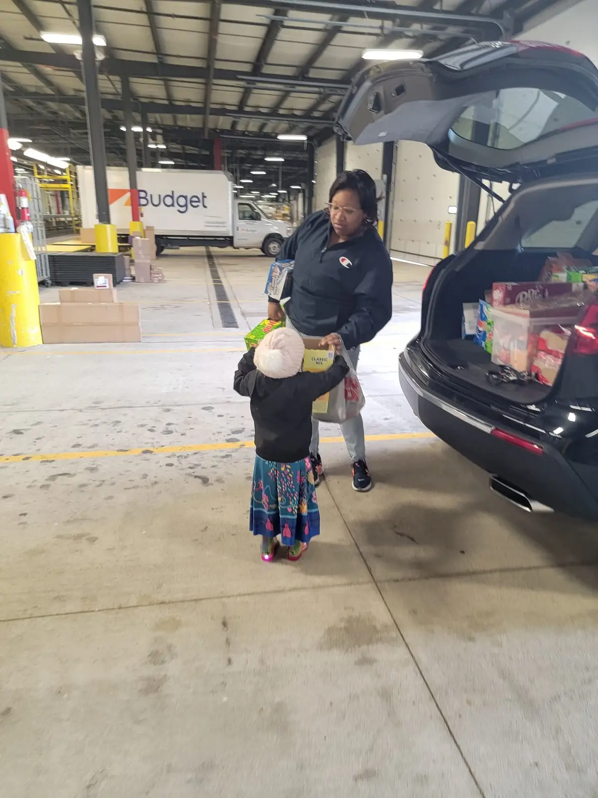 Robbyn and Ryleigh unloading vending products during a restock day